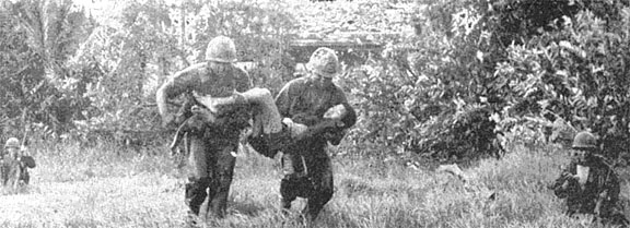 Wolfhounds carry wounded VC