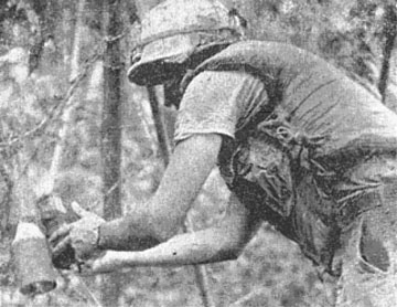 SSG Paul Hamel works on booby trap
