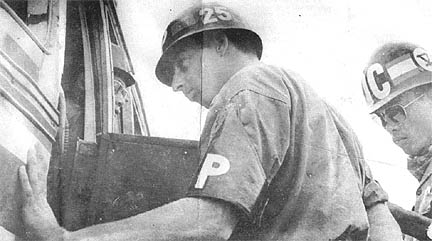 SP4 Harland Guffey checks bus