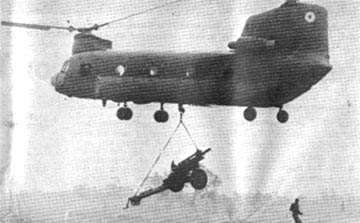 Chinook carrying howitzer