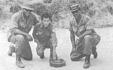 Pham Van Ngo displays mine