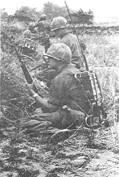 Sgt John Mohlar calls artillery, RTO Ross Ciccarello waits