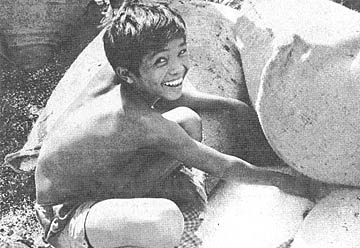 Cambodian boy gets rice