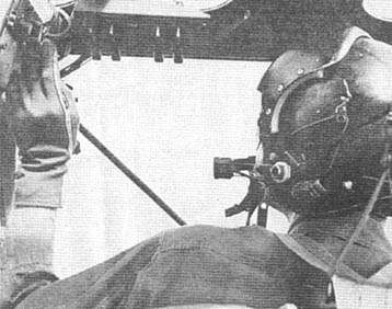 Bird Dog pilot adjusts radio
