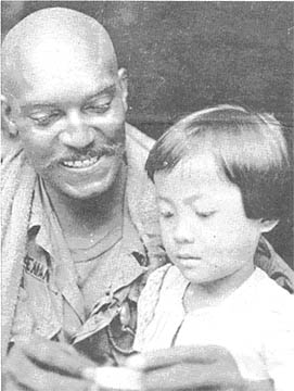 SP5 James Coleman and child