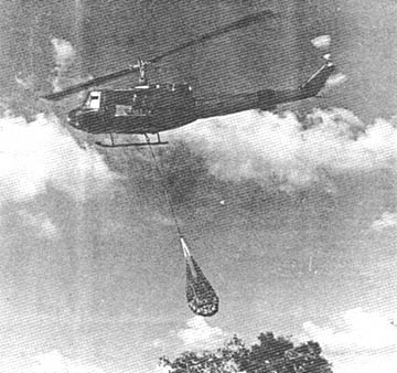 Huey lifting out captured rice